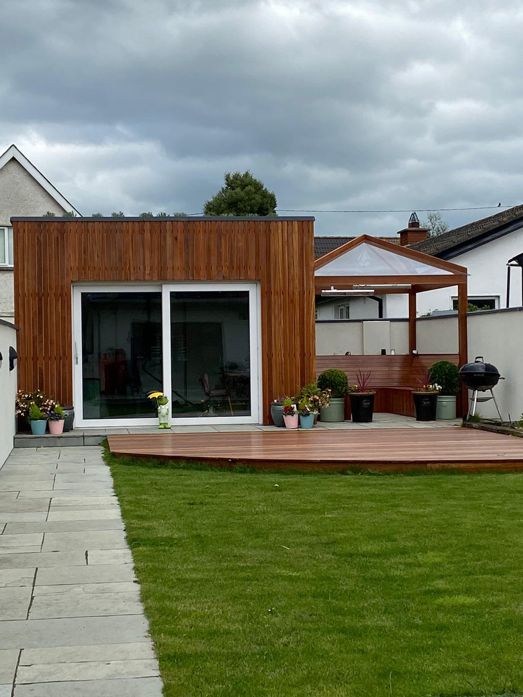 Apex wooden pergola with clear solid polycarbonate roof sheets