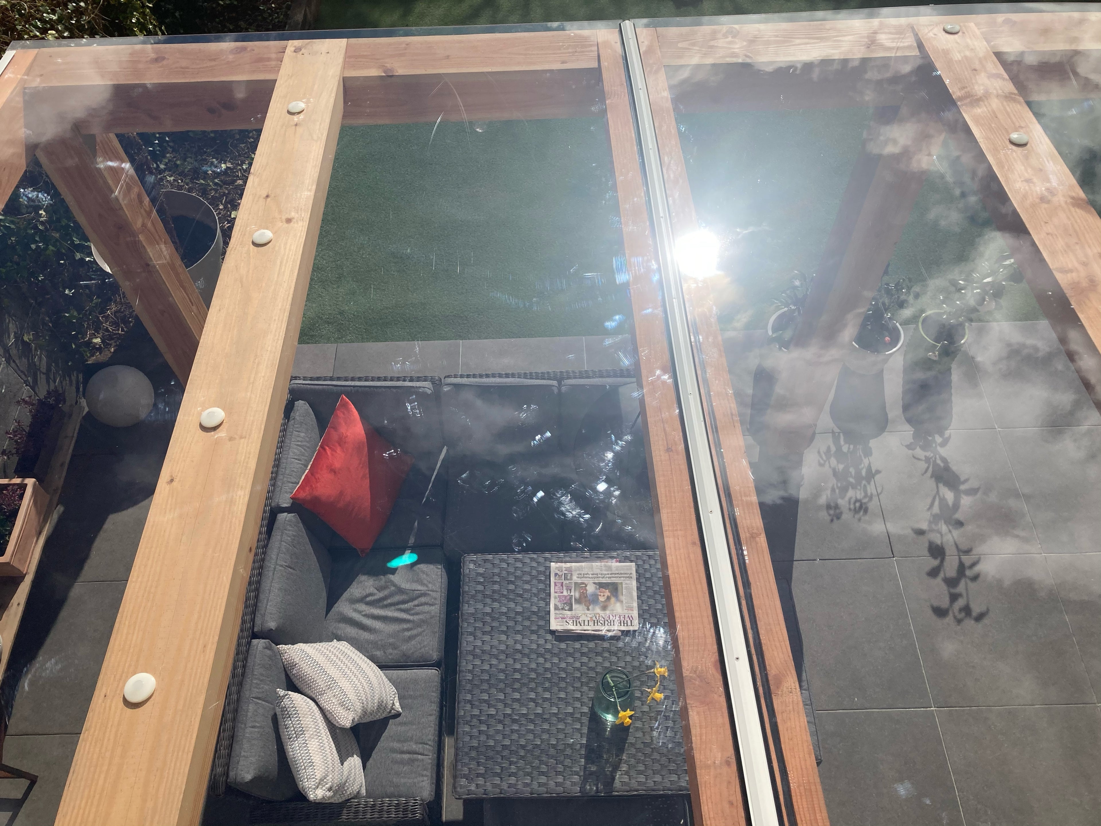 Solid clear polycarbonate sheet with capex glazing bars and fixing buttons